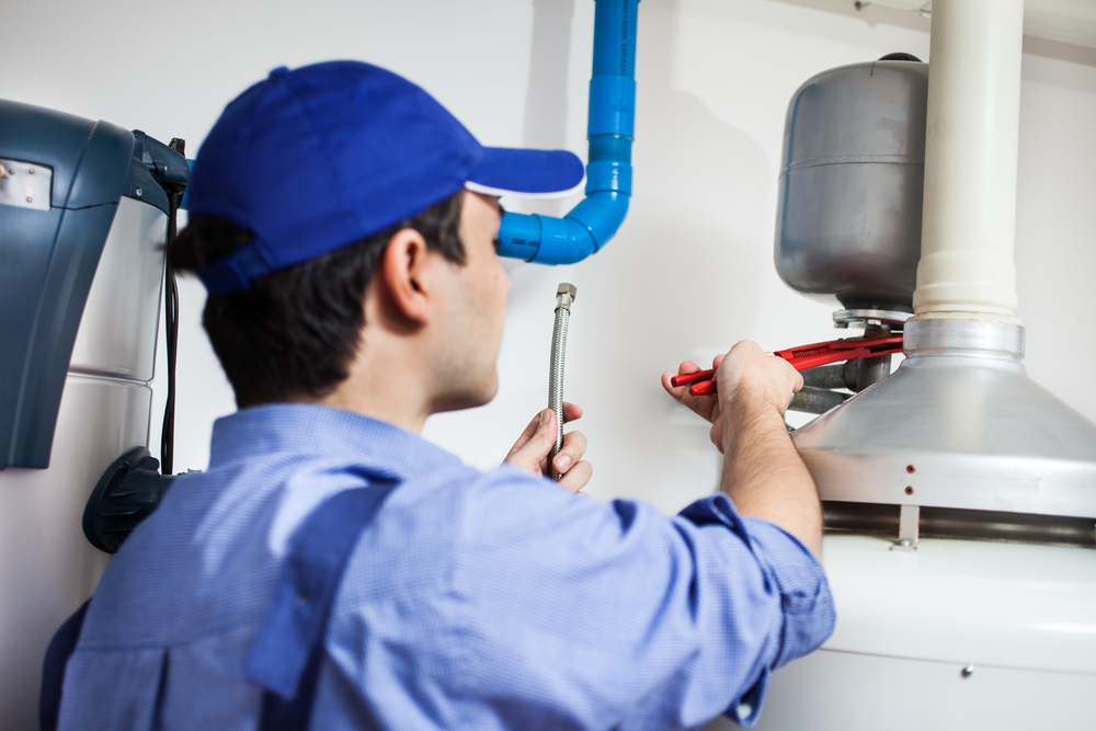 Plumber,Repairing,An,Hot-water,Heater