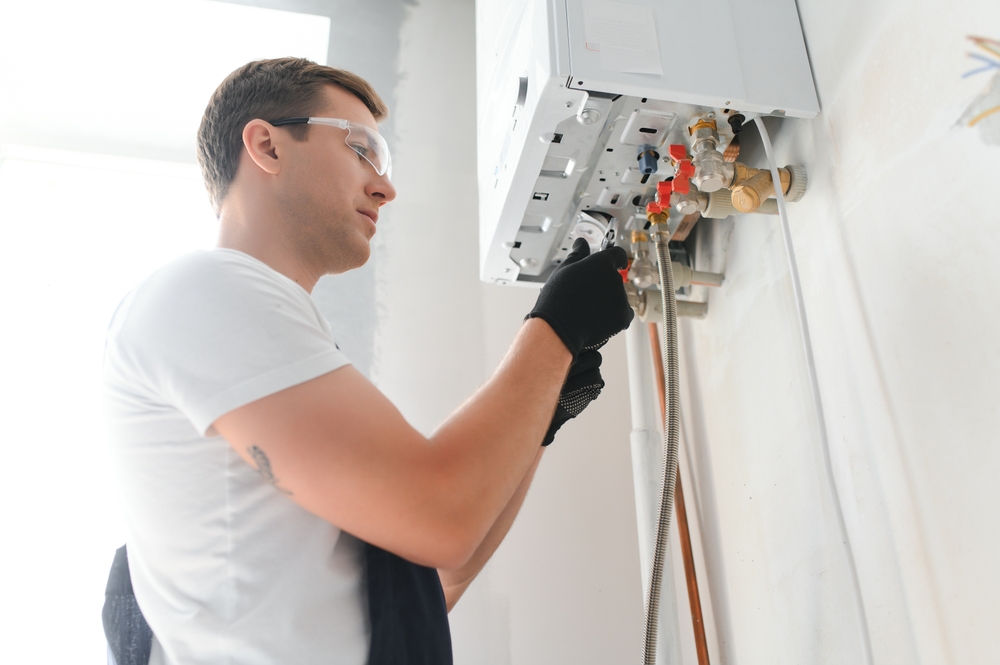 Professional,Plumber,Checking,A,Boiler,And,Pipes,,Boiler,Service,Concept.